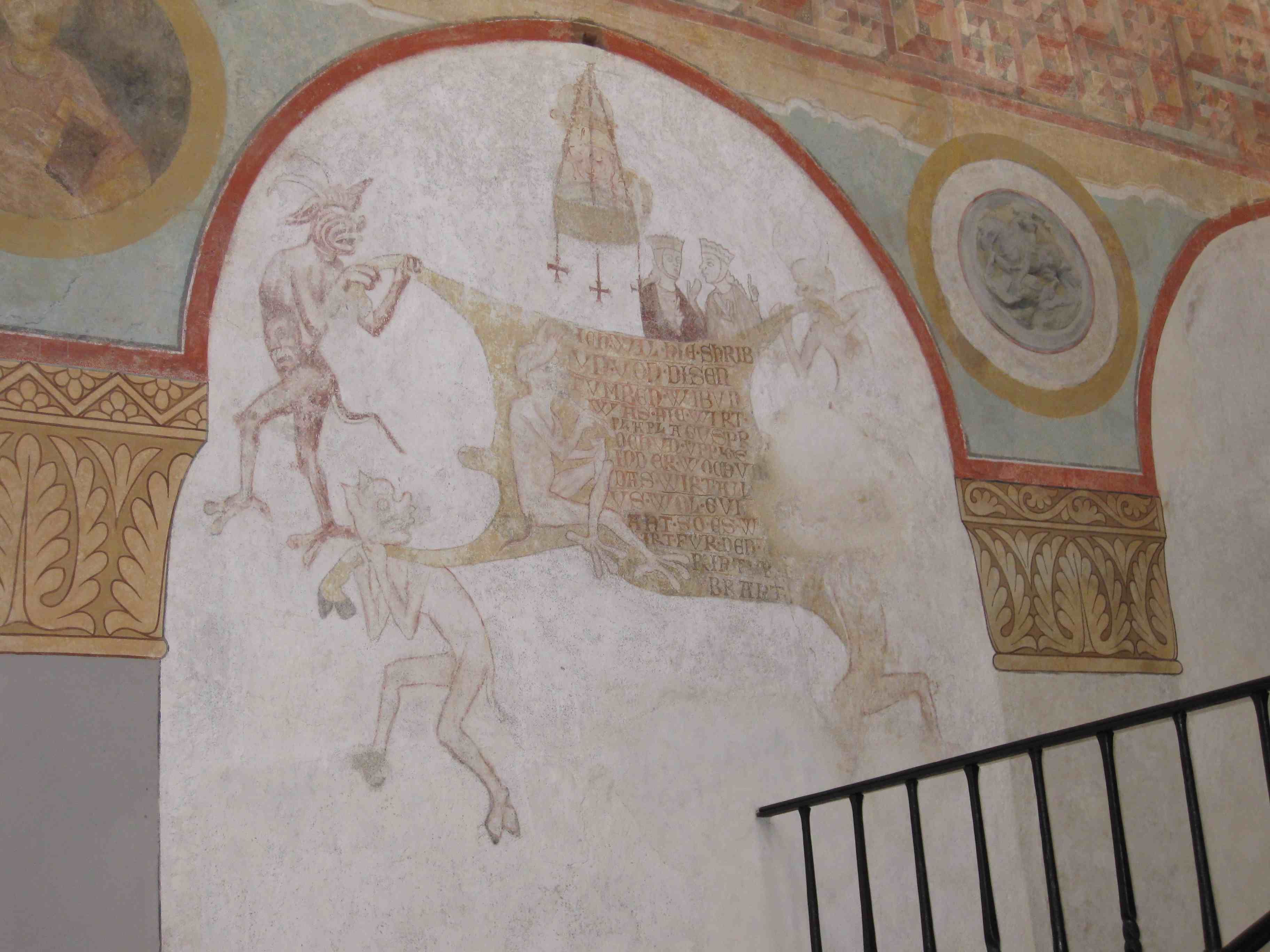 Reichenau: overburdened devils on a mural
